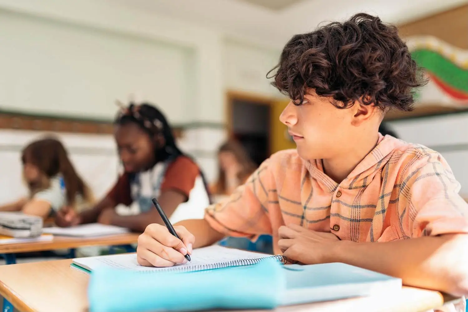 Students working at their desks in a classroom
